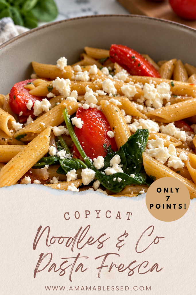 Copycat Noodles and Company Pasta Fresca with penne pasta, tomatoes, spinach, red onion, garlic, and feta cheese in a bowl.