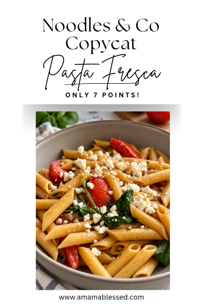 Copycat Noodles and Company Pasta Fresca with penne pasta, tomatoes, spinach, red onion, garlic, and feta cheese in a bowl.
