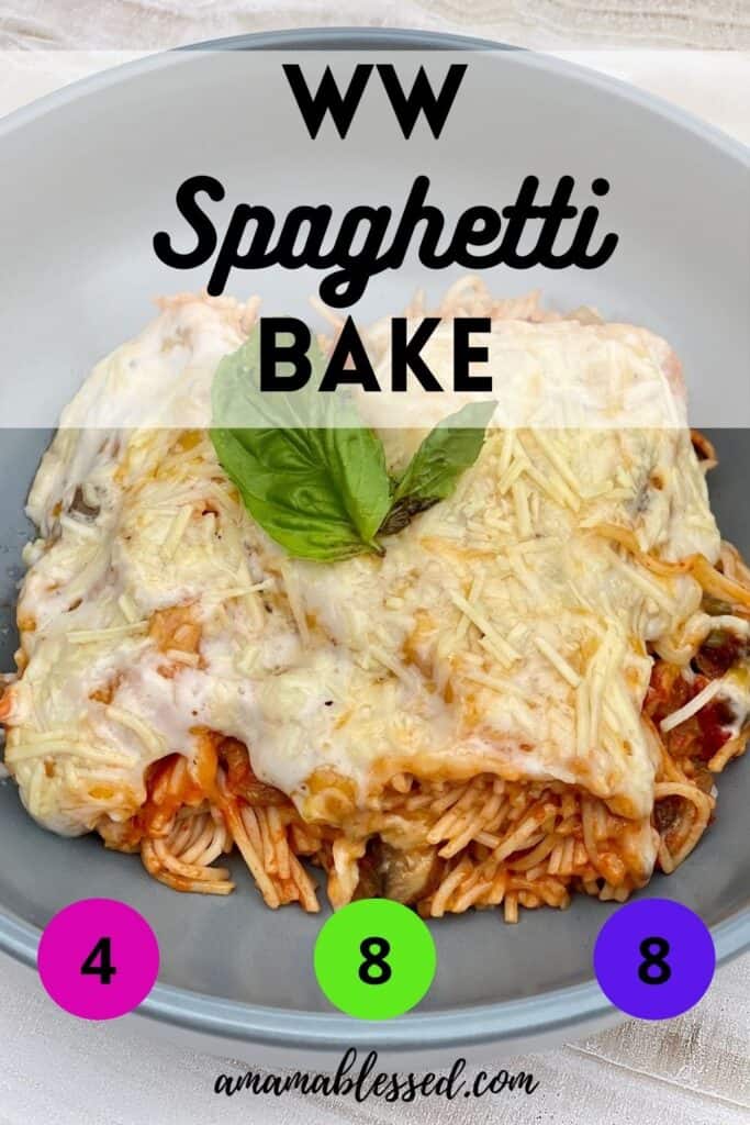 A portion of ww spaghetti bake sits atop a grey bowl topped with a garnish of basil.