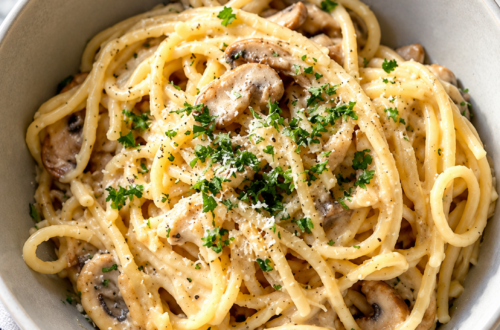 WW Mushroom Chicken Bake topped with parsley sits in a gray bowl.