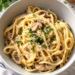 WW Mushroom Chicken Bake topped with parsley sits in a gray bowl.