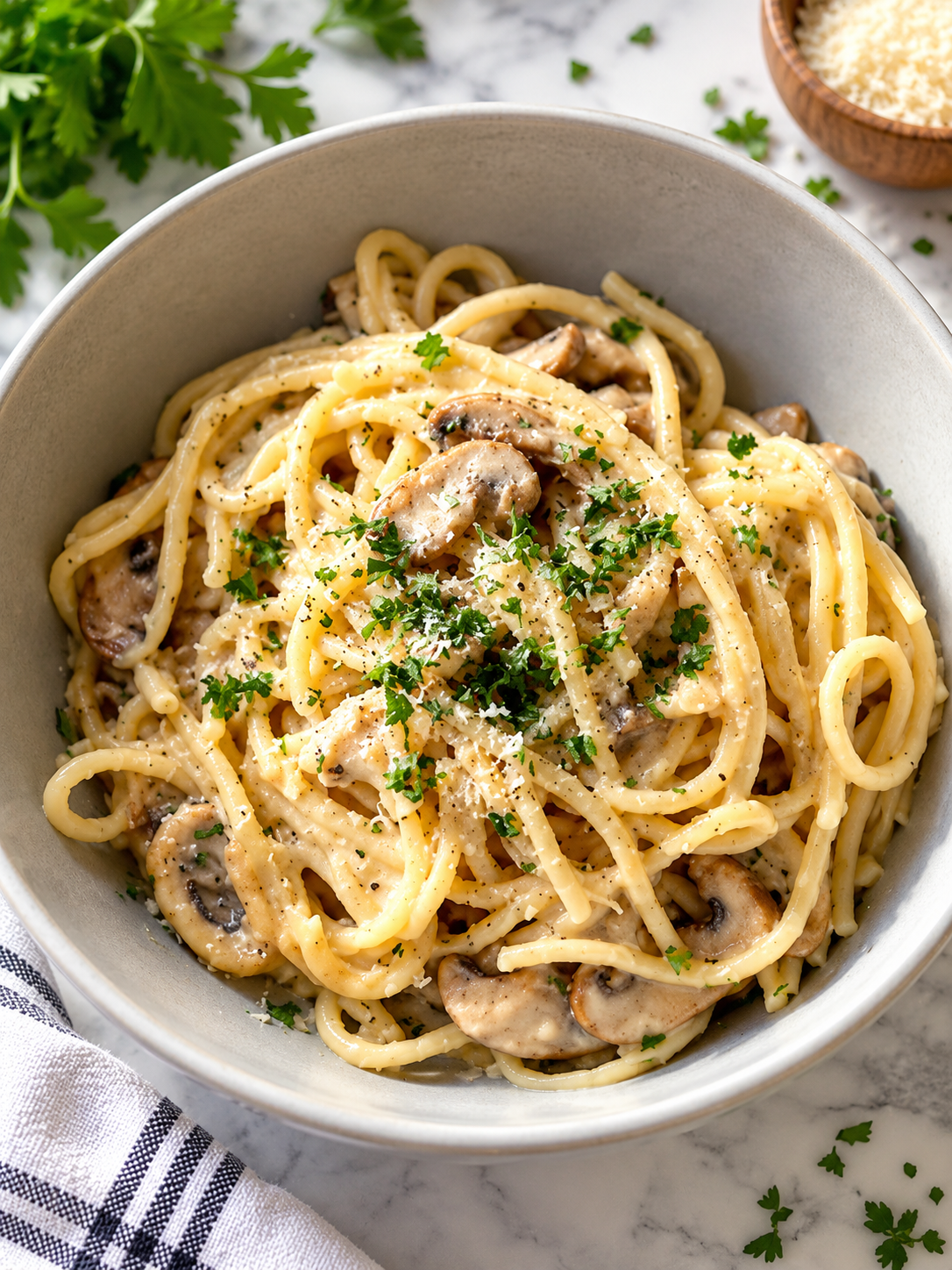 WW Mushroom Chicken Bake topped with parsley sits in a gray bowl.