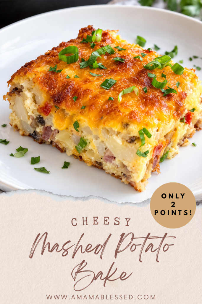 A slice of cheesy mashed potato bake sits on top of a white plate. 