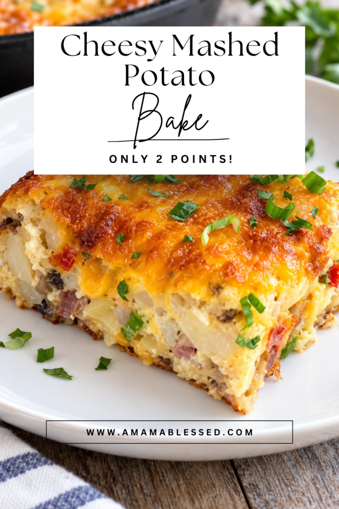 A slice of cheesy mashed potato bake topped with scallions sits on top of a white plate. 