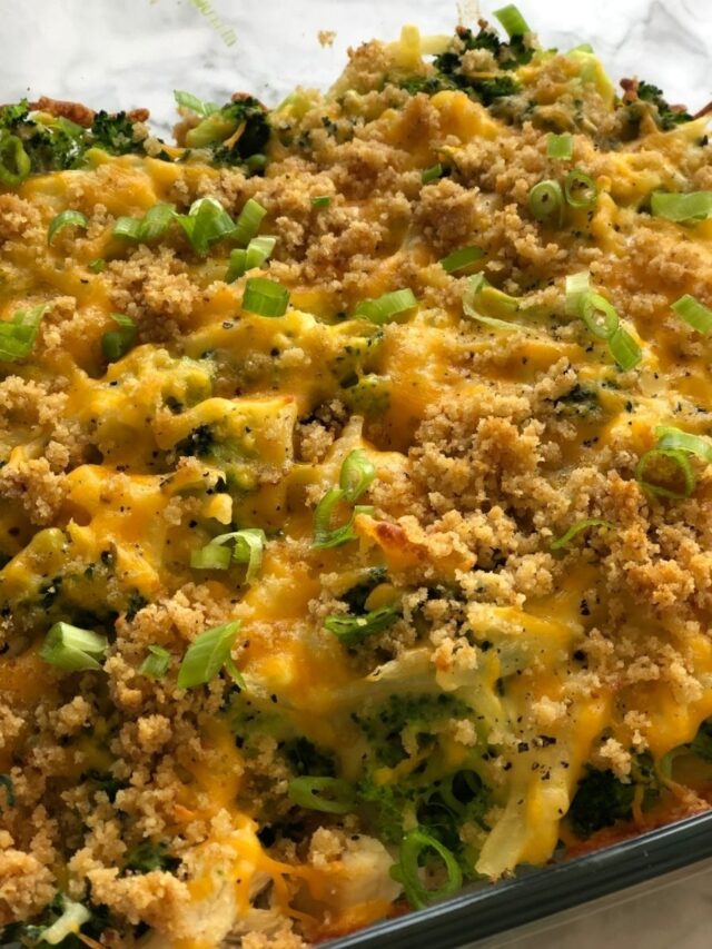 Chicken broccoli bake in a glass pan sits on the counter.